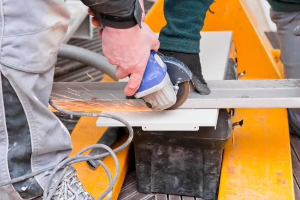 istock Handyman cutting sheet metal 1211178292