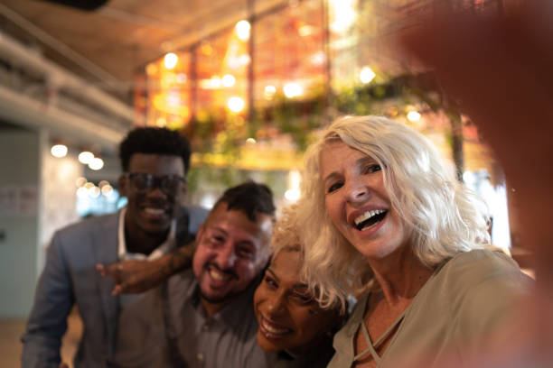 istock Business people taking a selfie at work 1211179642