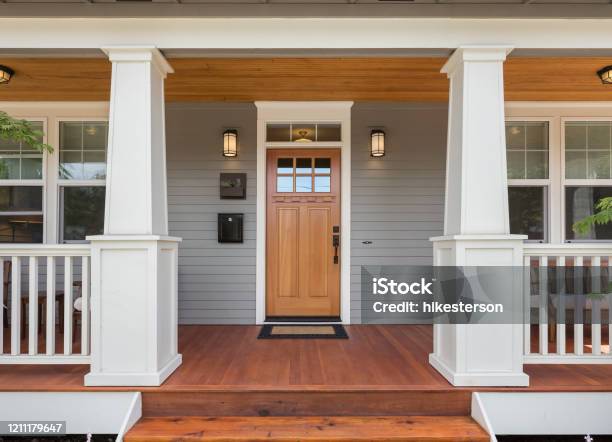 Covered Porch And Front Door Of Beautiful New Home Stock Photo - Download Image Now - House, Door, Residential Building