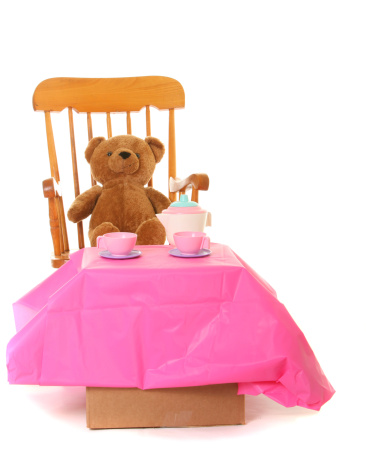 teddy bear in rocking chair having a tea party