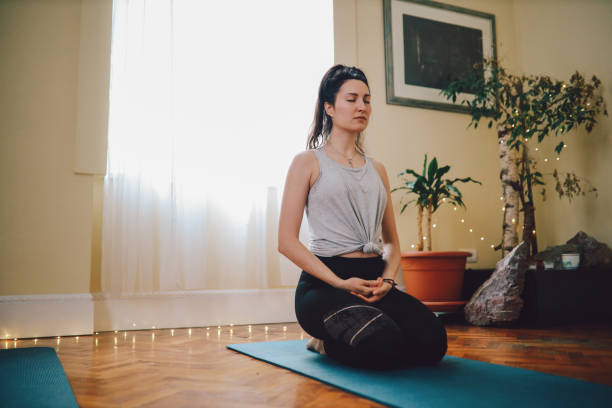 istock Woman practicing yoga in a studio 1211181833