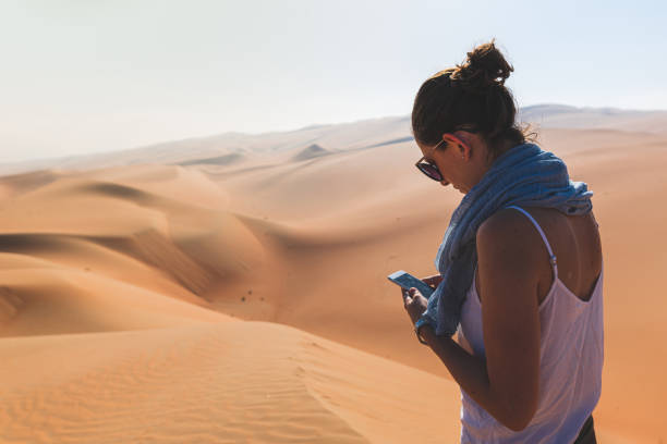 istock Woman hold her smartphone ant typing messages 1211182134