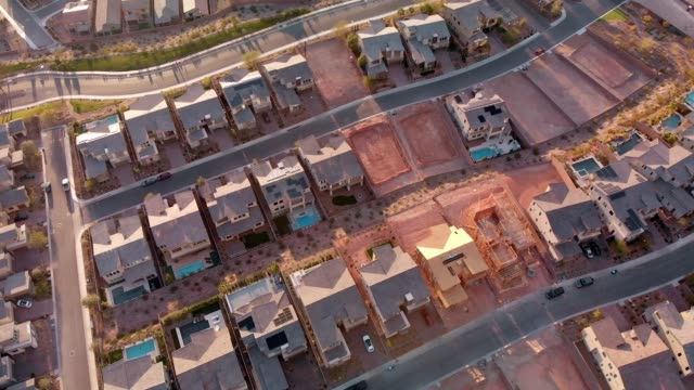 Brand New Residential Neighborhood with Homes under various stages of construction in a New Home subdivision in Las Vegas Nevada at Dusk