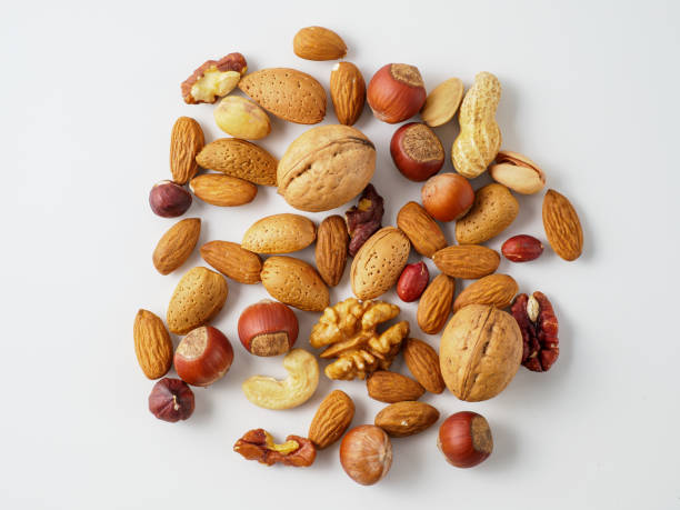 istock Mix of nuts isolated on white background. 1211184486
