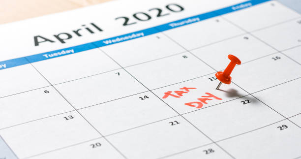 istock Tax day pinned on calendar 1211187224