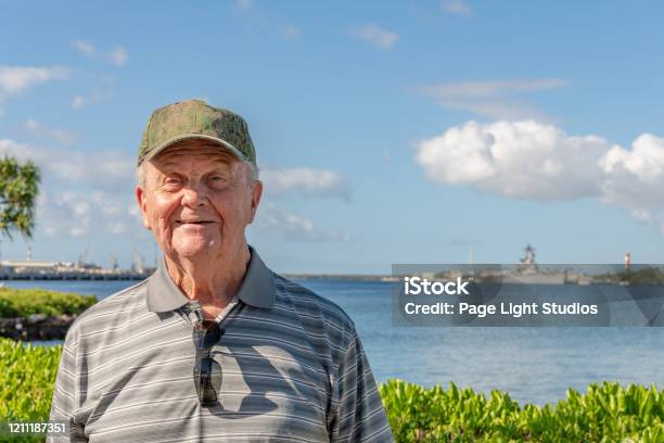 Senior Man Visiting Hawaii Wearing Hat Stock Photo - Download Image Now - Veteran, Hawaii Islands, Senior Adult