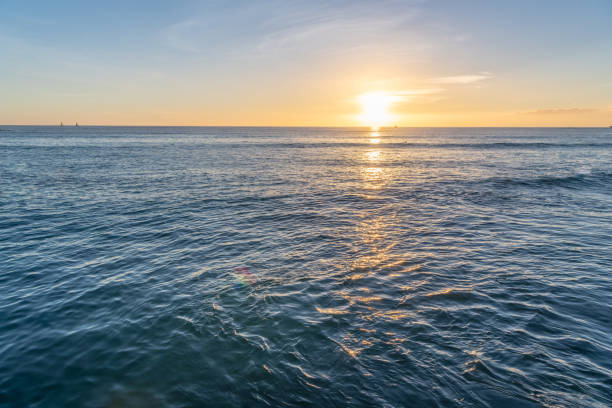 istock Beautiful yellow sunset over a deep blue ocean 1211187371