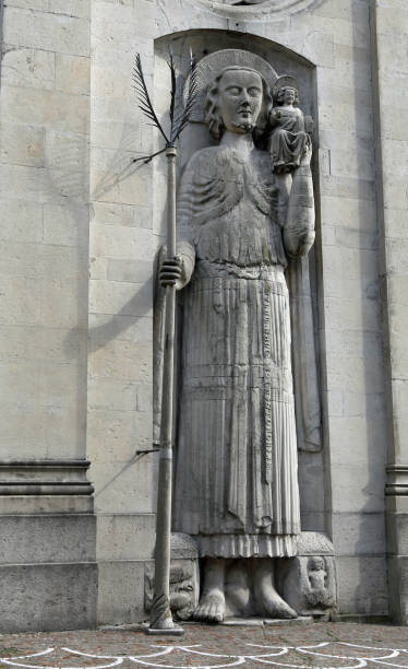 statue of St Christopher of ancient Cathedral in Gemona town statue of St Christopher of ancient Cathedral in Gemona del Friuli in Northern Italy. The Church was destroyed by an earthquake in 1976 gemona del friuli stock pictures, royalty-free photos & images