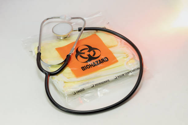 istock Stethoscope with Face Masks in a Biohazard Bag 1211190155