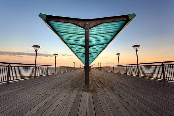 Boscombe Pier Sunset over Boscombe Pier in Bournemouth, Dorset boscombe photos stock pictures, royalty-free photos & images
