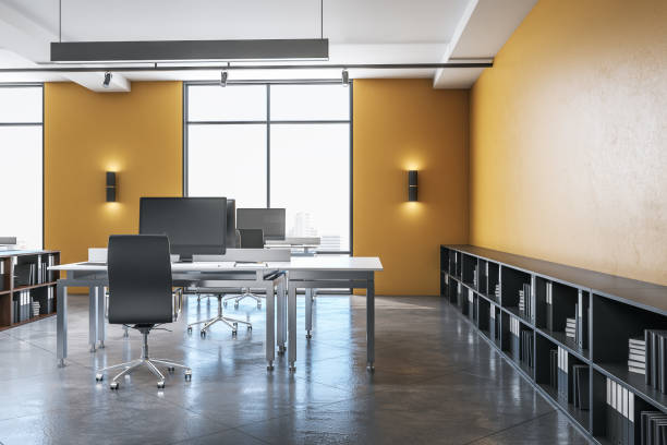 istock Computer in yellow office interior with city view, 1211191808