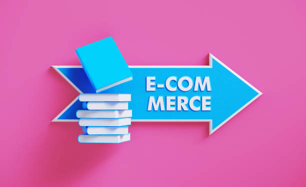 istock Book Stack Sitting over A Blue Arrow Shaped Directional Sign on Pink Background 1211192330