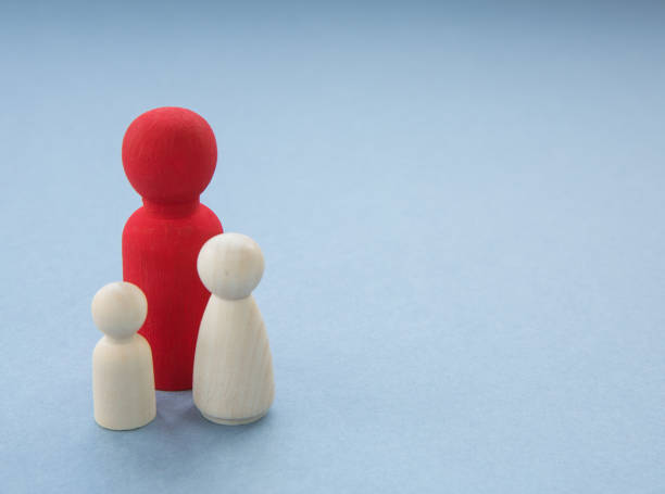 istock A Single parent and two children in a concept image 1211192361