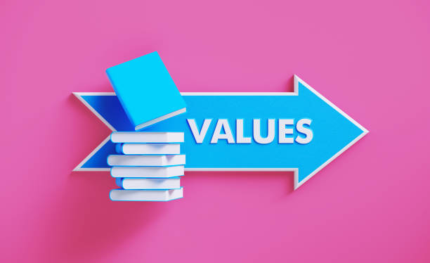 istock Book Stack Sitting over A Blue Arrow Shaped Directional Sign on Pink Background 1211192407