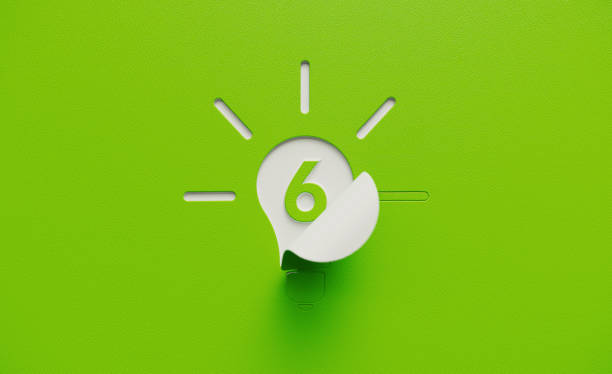White Light Bulb Shape with Number Six Folding on Green Background White lightbulb shape folding on green background. Number six written on the light bulb shape. Horizontal composition with copy space. number 6 photos stock pictures, royalty-free photos & images