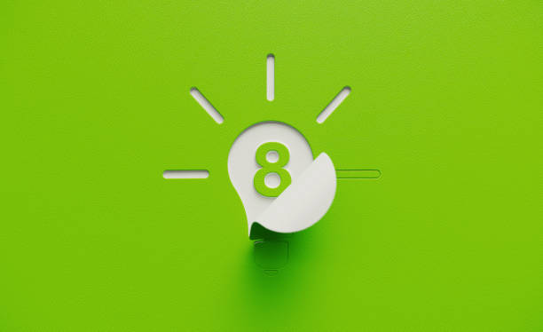 istock White Light Bulb Shape with Number Eight Folding on Green Background 1211197565
