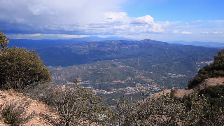 Montserrat Time lapse video - Views from Canal de Sant Jeroni towards Pyrenees a stormy day