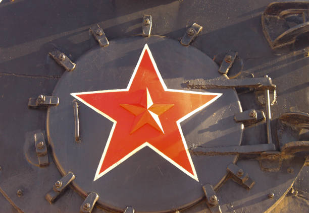 Soviet old steam train front side with a red star. Painted metalic background