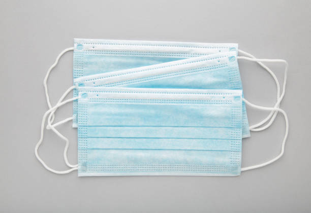 istock Medical masks on a grey background with copy space. Coronavirus 1211200433