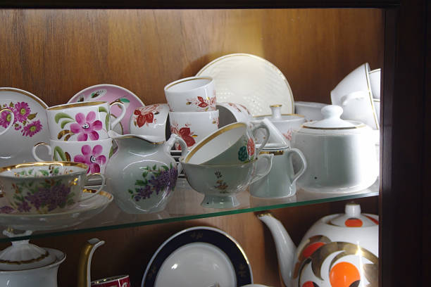 istock vintage porcelain tableware on a glass shelf 1211201197