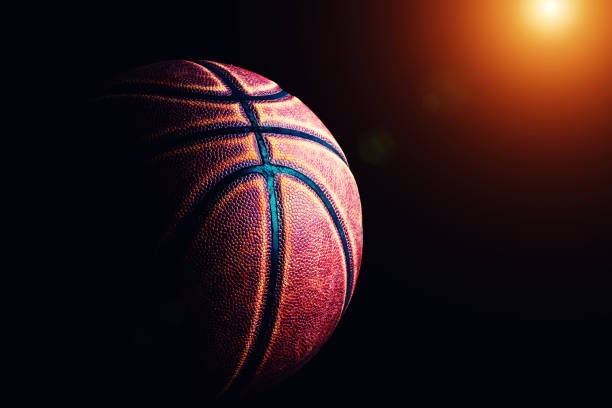 istock basketball ball on black background. 1211201713