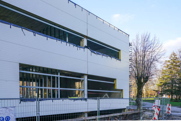 wall assembly of a new building using steel sandwich panels wall assembly of a new modern building using steel sandwich panels sandwich panel photos stock pictures, royalty-free photos & images