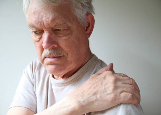 istock Older man with bad pain in his shoulder 1211205319