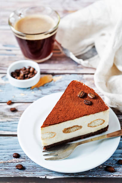 istock Tiramisu cake decorated with coffee beans with coffee drink 1211205520