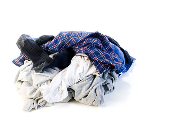 Pile of dirty laundry on white background stock photo