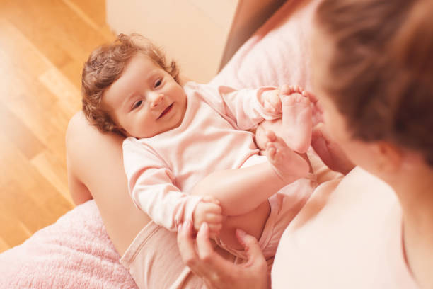 istock Mother holding baby closeup 1211206273