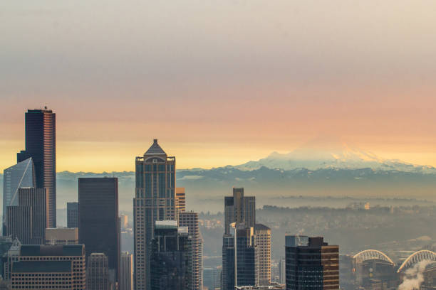 istock Cityscape with hazy snowcapped mountain in the background 1211206371