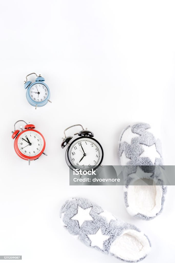 Document Schaken Centimeter Soft Fluffy Slippers And Alarm Clocks Stock Photo - Download Image Now -  Alarm Clock, Bedtime, Bell - iStock