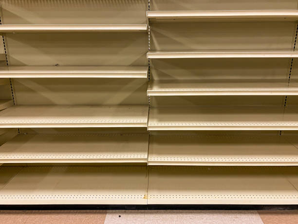 istock Empty Grocery Store Shelves With No Products Available After Sell Out 1211211204
