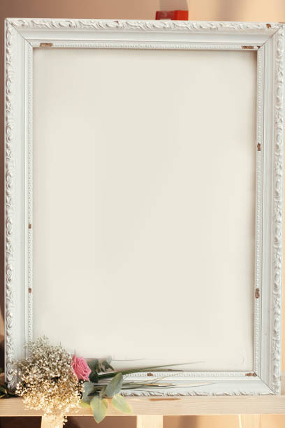 istock empty vintage board frame with space for text and pink rose bouquet, wedding welcome desk, setting arrangement. luxury wedding decor at reception 1211213582