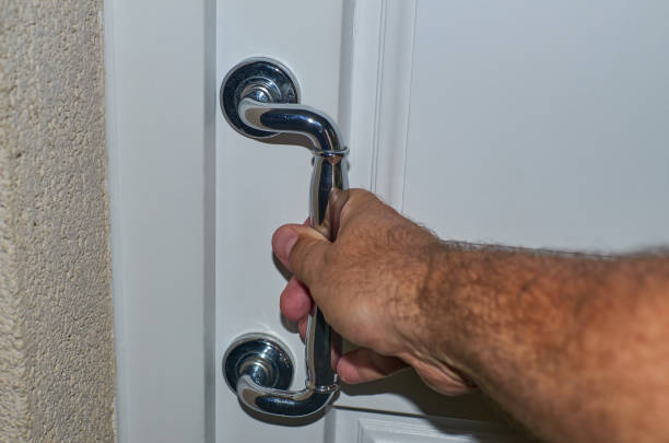 istock Male hand on a door handle 1211213959