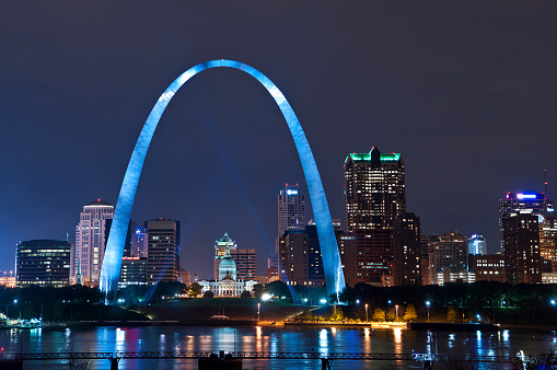 Image of St. Louis downtown with Gateway Arch at night.