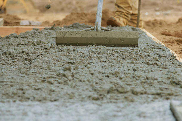 istock Cement pouring during sidewalk in new residential home 1211217594