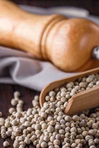 istock white peppercorns in wooden scoop on rustic background 1211217684