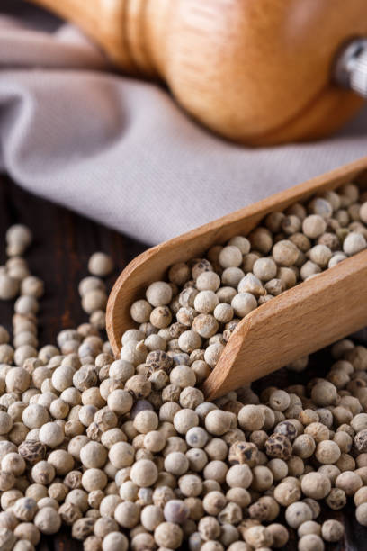 istock white peppercorns in wooden scoop on rustic background 1211217712
