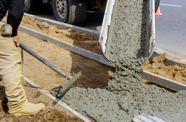 istock Concrete being poured from a truck into a concrete with sidewalk 1211217727
