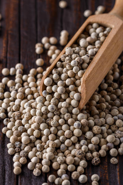 istock white peppercorns in wooden scoop on rustic background 1211217870