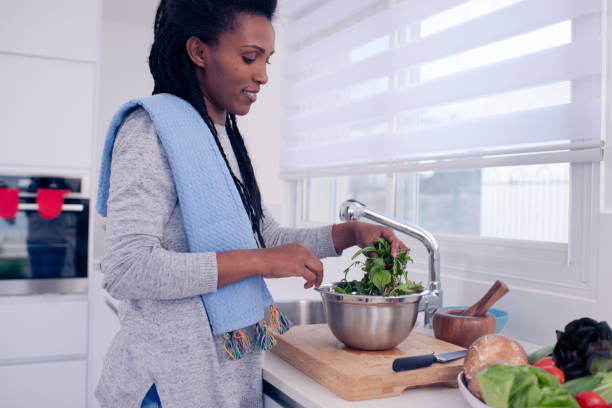 istock Woman preparing fresh salad. 1211217874