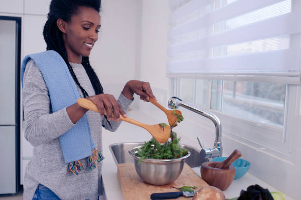 istock Woman preparing fresh salad. 1211217934