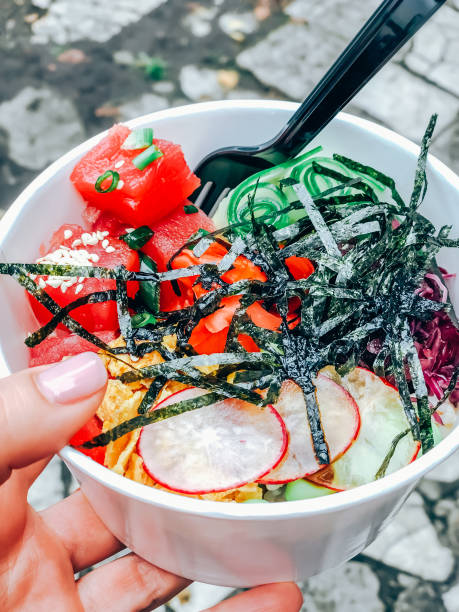 istock Poke bowl with tuna fish in paper container 1211219772