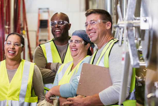 istock Multi-ethnic group of workers in factory 1211220052