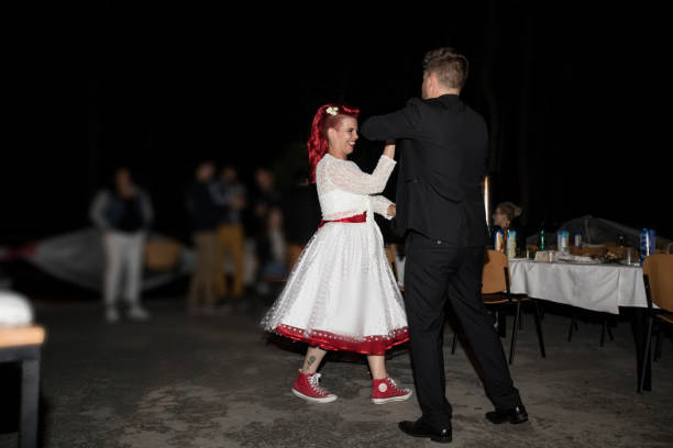 istock Just Married Wife and Husband Enjoying Their First Dance 1211221207