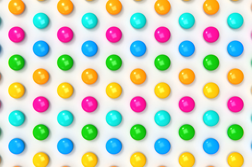 Colourful chocolate bean candies on white background stock photo