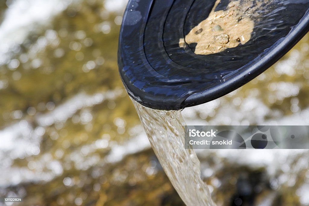 gold pan Panning for gold in a northern michigan stream Panning for Gold Stock Photo