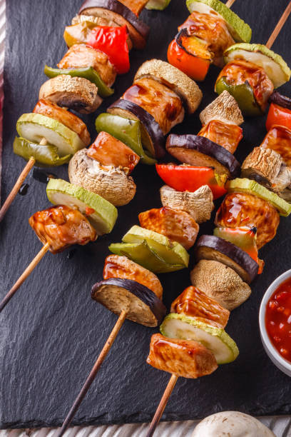istock chicken kebabs with vegetables and mushrooms on a rustic background 1211228876