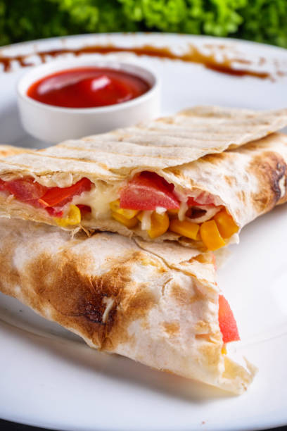 istock pita meat roll with chicken meat tomato cheese and corn 1211230096